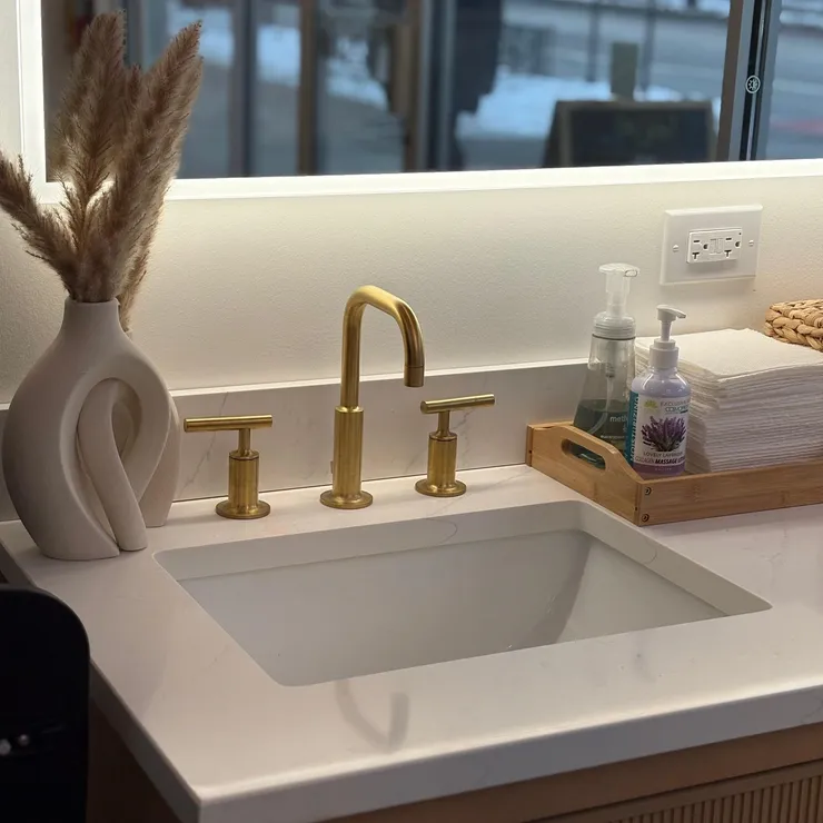 Gold fixtures at the salon sink